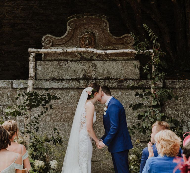 Wedding Ceremony | Bride in Lace Back Pronovias Wedding Dress | Groom in Hawes and Curtis Navy Suit &amp; Bow Tie | Outdoor Cornish Wedding at Boconnoc Estate | Nick Walker Photography