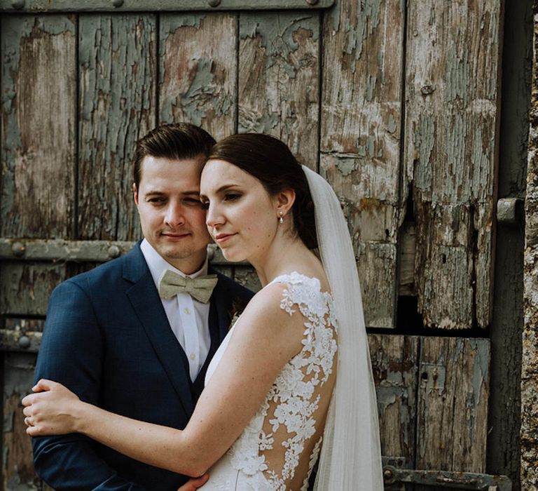 Bride in Lace Back Pronovias Wedding Dress | Groom in Hawes and Curtis Navy Suit &amp; Bow Tie | Outdoor Cornish Wedding at Boconnoc Estate | Nick Walker Photography