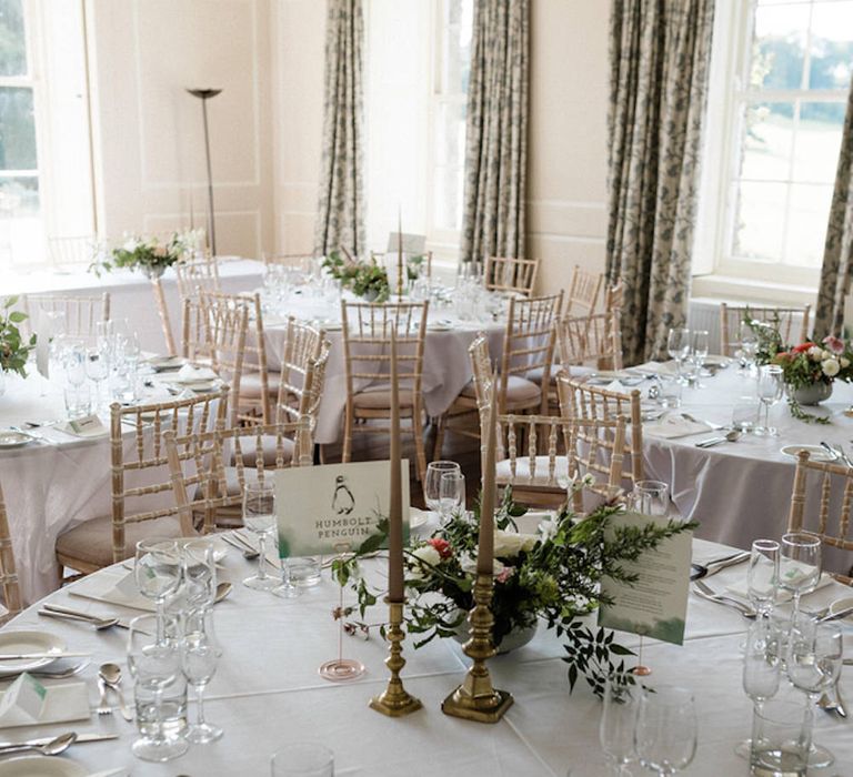 Floral Centrepiece by The Garden Gate Flower Company | Table Name Animal Illustrations by Dearly Beloved Wedding Stationery Designs | Outdoor Cornish Wedding at Boconnoc Estate | Nick Walker Photography