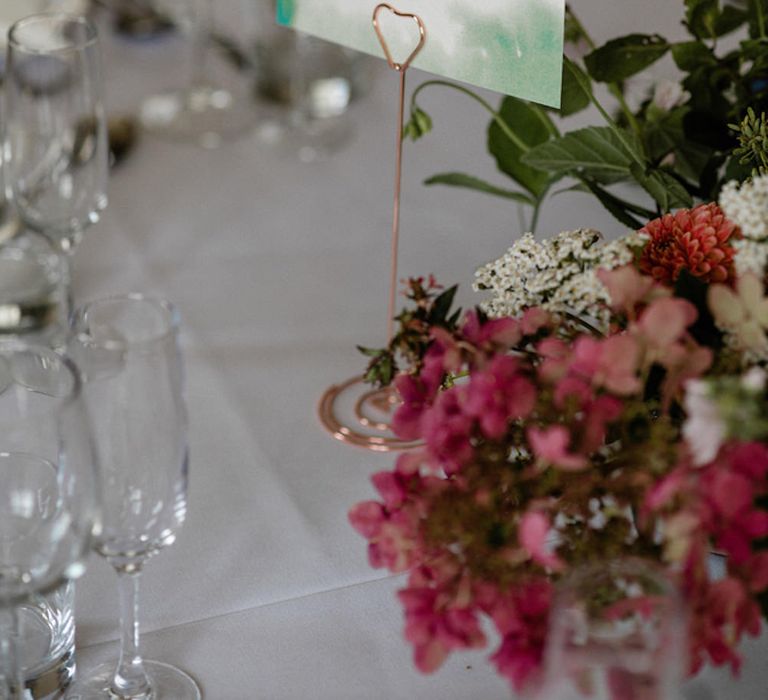 Floral Centrepiece by The Garden Gate Flower Company | Table Name Animal Illustrations by Dearly Beloved Wedding Stationery Designs | Outdoor Cornish Wedding at Boconnoc Estate | Nick Walker Photography