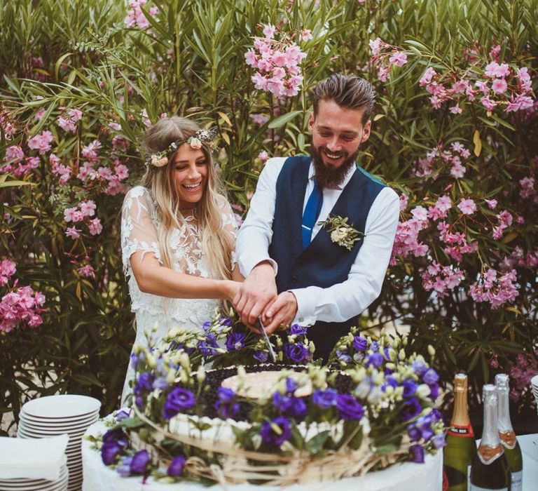 Couple Cutting Wedding Cake