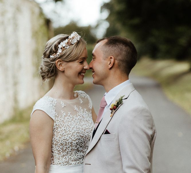 Bride and groom portrait with bride in embroidered Rime Arodaky wedding dress and groom in stone blazer