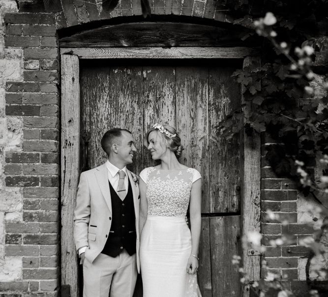 Black and white portrait of the bride and groom at Bury Court Barn