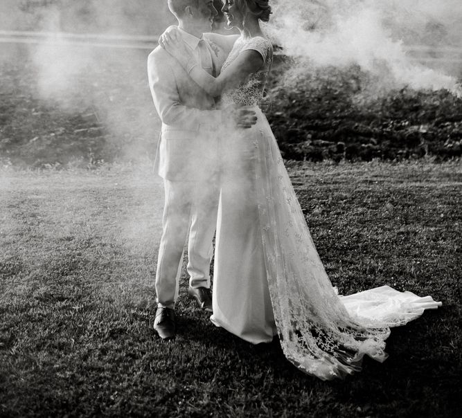 Bride and groom smoke bomb portrait