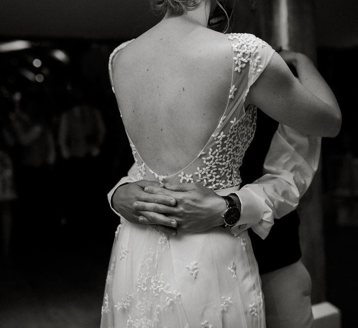 First dance with bride in backless Rime Arodaky wedding dress with embroidered detail