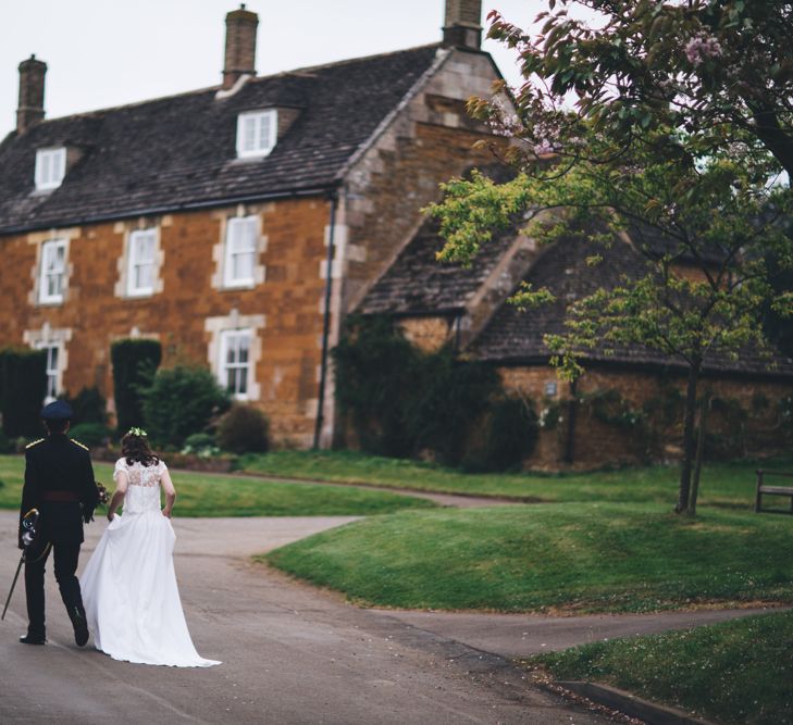 Military Wedding in Rutland Village with Marquee Reception filled with Swallows and Damsons Flowers | Jesús Peiró Bridal Gown | Pink Monsoon Bridesmaid Dresses | Mike Plunkett Photography