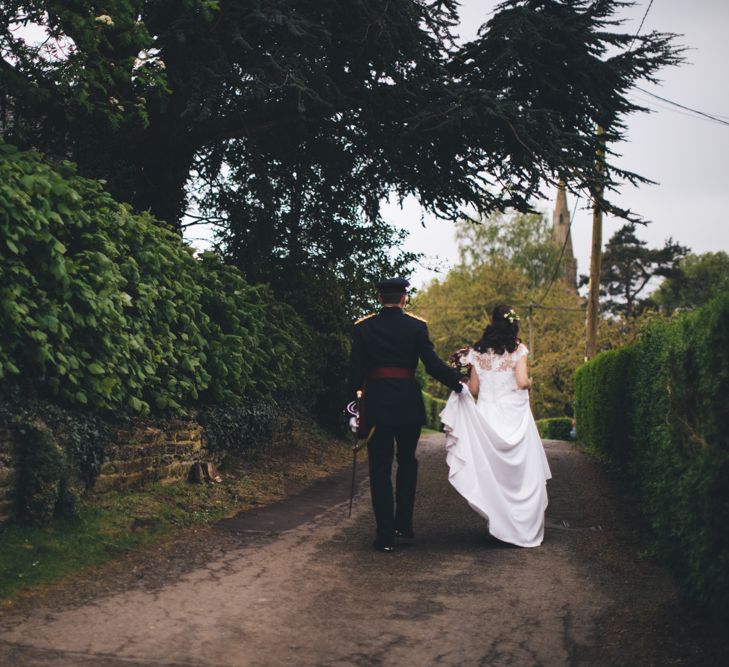 Military Wedding in Rutland Village with Marquee Reception filled with Swallows and Damsons Flowers | Jesús Peiró Bridal Gown | Pink Monsoon Bridesmaid Dresses | Mike Plunkett Photography