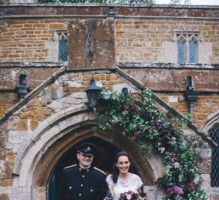 Military Wedding in Rutland Village with Marquee Reception filled with Swallows and Damsons Flowers | Jesús Peiró Bridal Gown | Pink Monsoon Bridesmaid Dresses | Mike Plunkett Photography