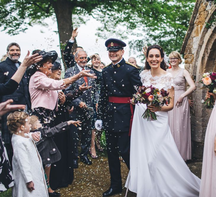 Military Wedding in Rutland Village with Marquee Reception filled with Swallows and Damsons Flowers | Jesús Peiró Bridal Gown | Pink Monsoon Bridesmaid Dresses | Mike Plunkett Photography