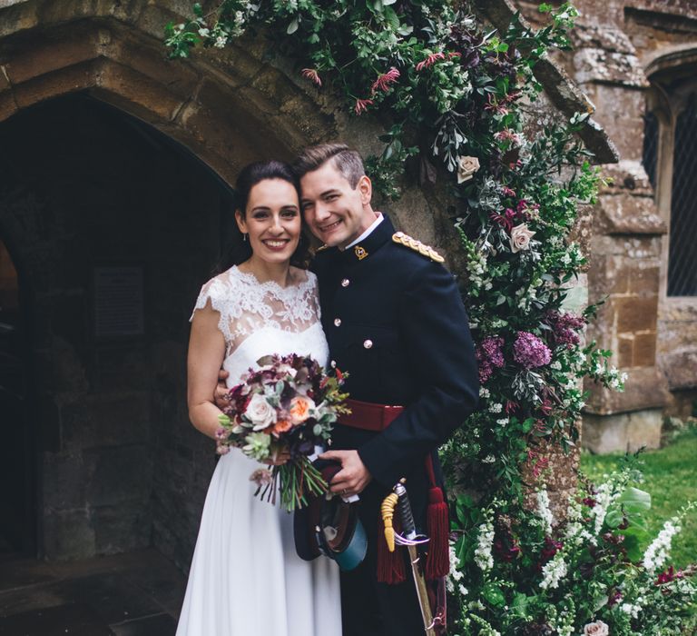 Military Wedding in Rutland Village with Marquee Reception filled with Swallows and Damsons Flowers | Jesús Peiró Bridal Gown | Pink Monsoon Bridesmaid Dresses | Mike Plunkett Photography