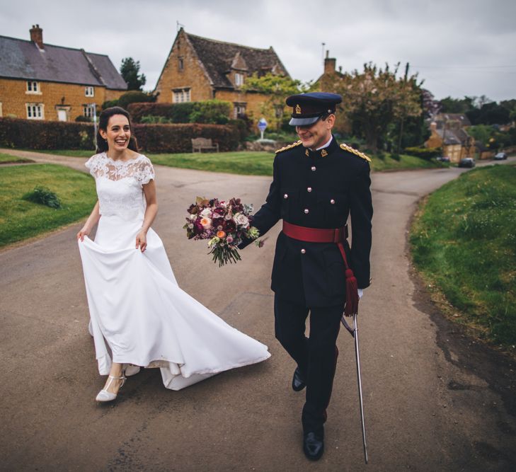 Military Wedding in Rutland Village with Marquee Reception filled with Swallows and Damsons Flowers | Jesús Peiró Bridal Gown | Pink Monsoon Bridesmaid Dresses | Mike Plunkett Photography