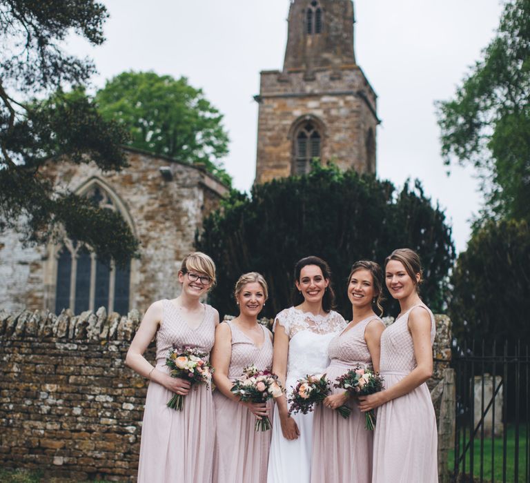 Military Wedding in Rutland Village with Marquee Reception filled with Swallows and Damsons Flowers | Jesús Peiró Bridal Gown | Pink Monsoon Bridesmaid Dresses | Mike Plunkett Photography