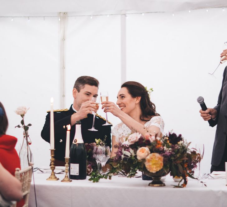 Military Wedding in Rutland Village with Marquee Reception filled with Swallows and Damsons Flowers | Jesús Peiró Bridal Gown | Pink Monsoon Bridesmaid Dresses | Mike Plunkett Photography