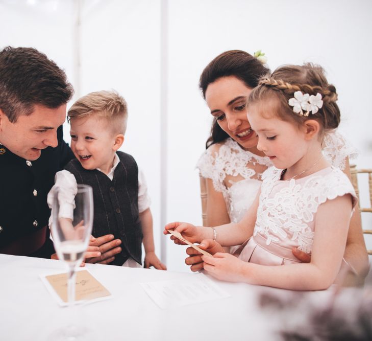 Military Wedding in Rutland Village with Marquee Reception filled with Swallows and Damsons Flowers | Jesús Peiró Bridal Gown | Pink Monsoon Bridesmaid Dresses | Mike Plunkett Photography