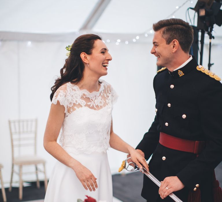 Military Wedding in Rutland Village with Marquee Reception filled with Swallows and Damsons Flowers | Jesús Peiró Bridal Gown | Pink Monsoon Bridesmaid Dresses | Mike Plunkett Photography