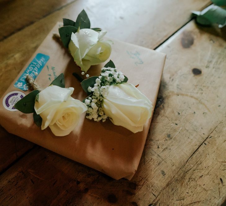 White Wedding Flower Buttonholes To Compliment Pink Wedding Dress