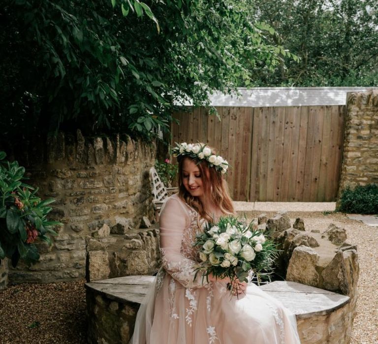 Bride In Pink Wedding Dress With White Wedding Flowers