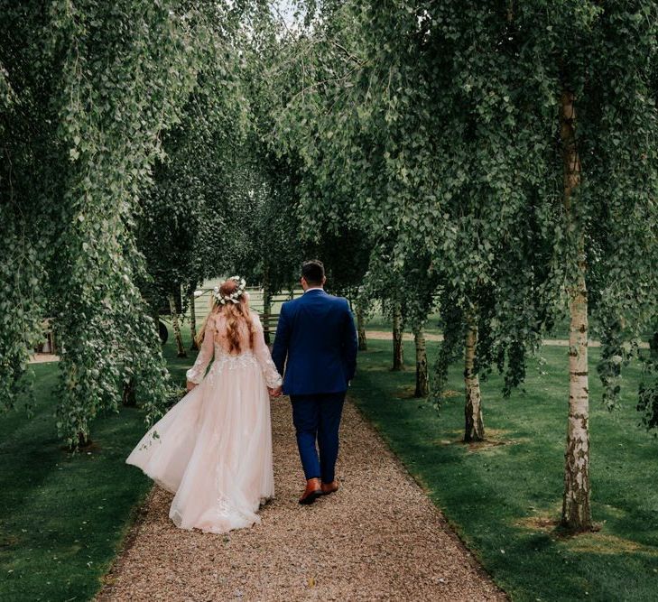 Bride and Groom Stroll After Ceremony