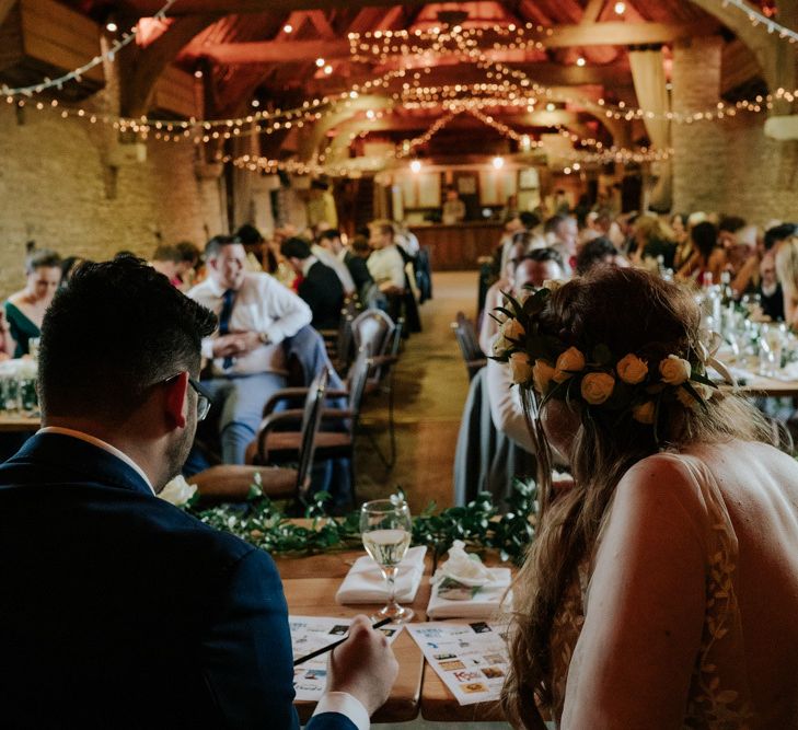 Bride and Groom Watch On With Flower Crown