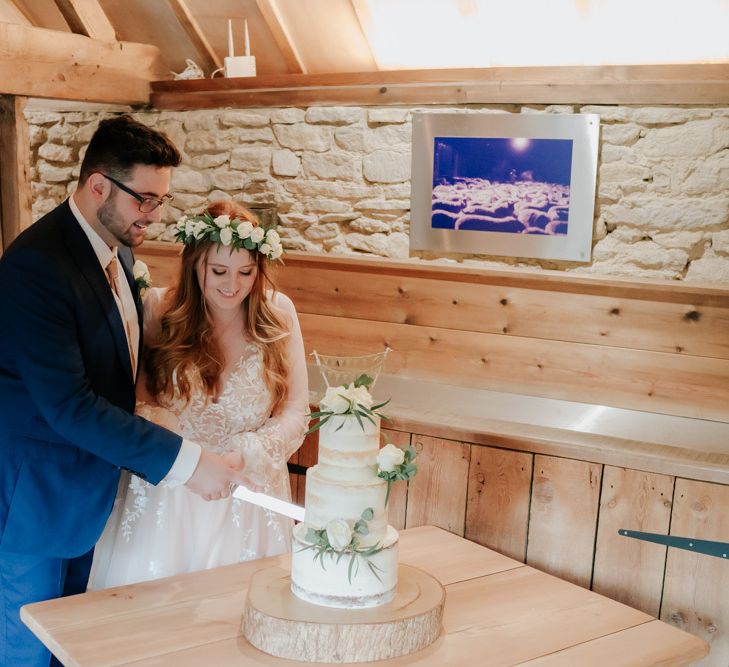 Bride and Groom Cut The Semi-Naked Wedding Cake