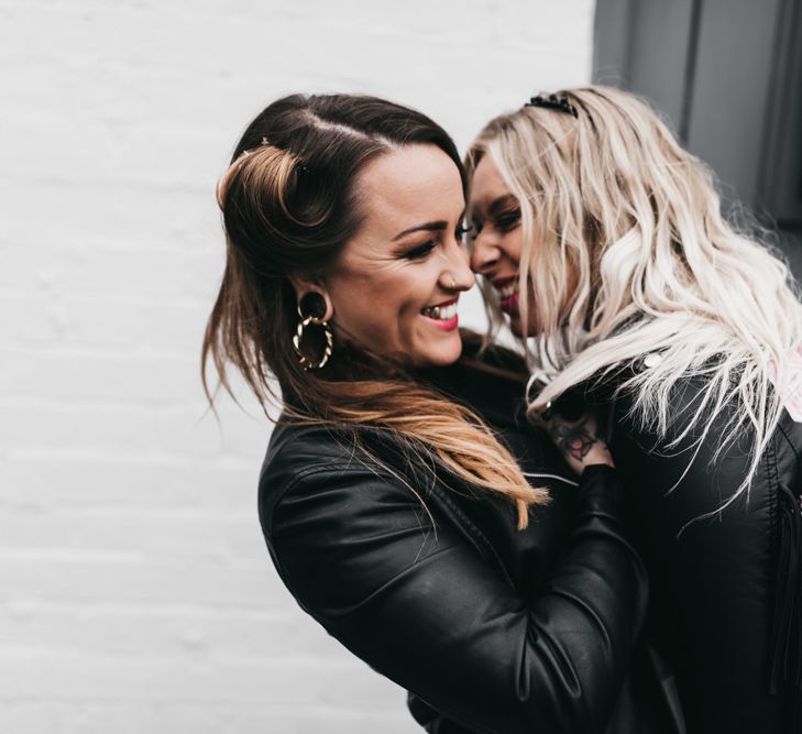 Intimate portrait of Rock n Roll brides in leather coats