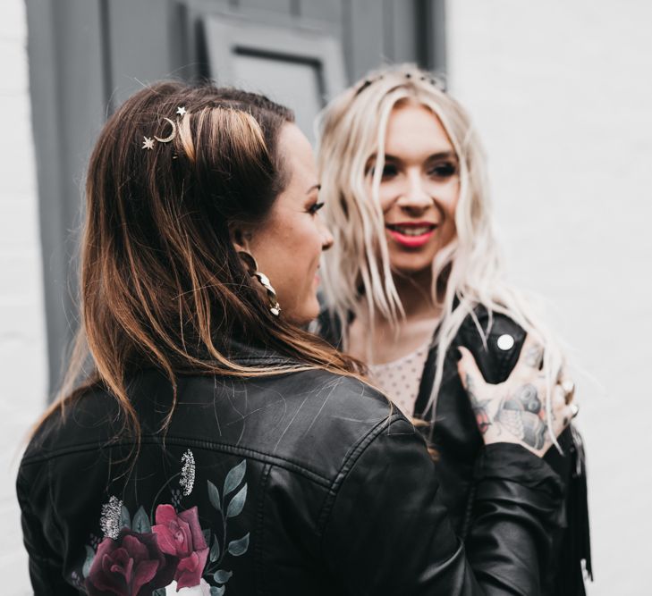 Alternative bride with tattoos and leather jacket