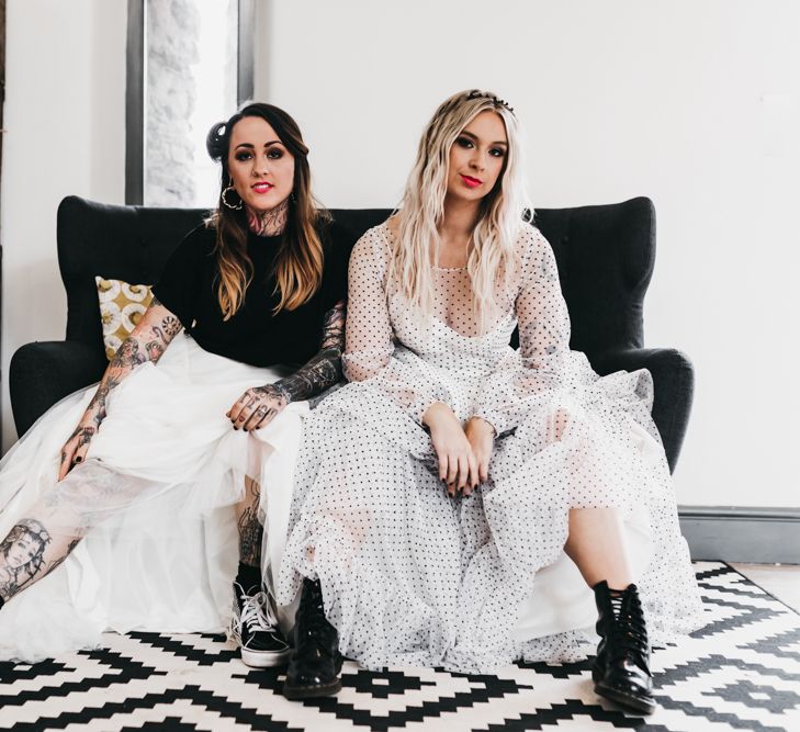 Same sex couple in polka dot black and white wedding dress and bridal separates