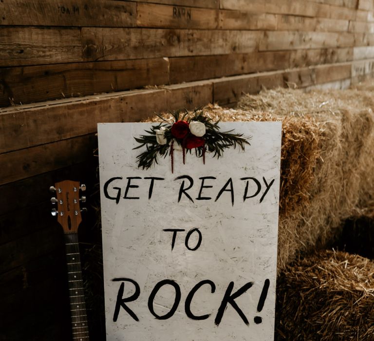 Get Ready to Rock Wedding Sign with Guitar and Hurricane Vase Decor