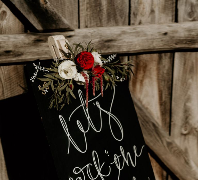 Black Wedding Sign with Floral Decor