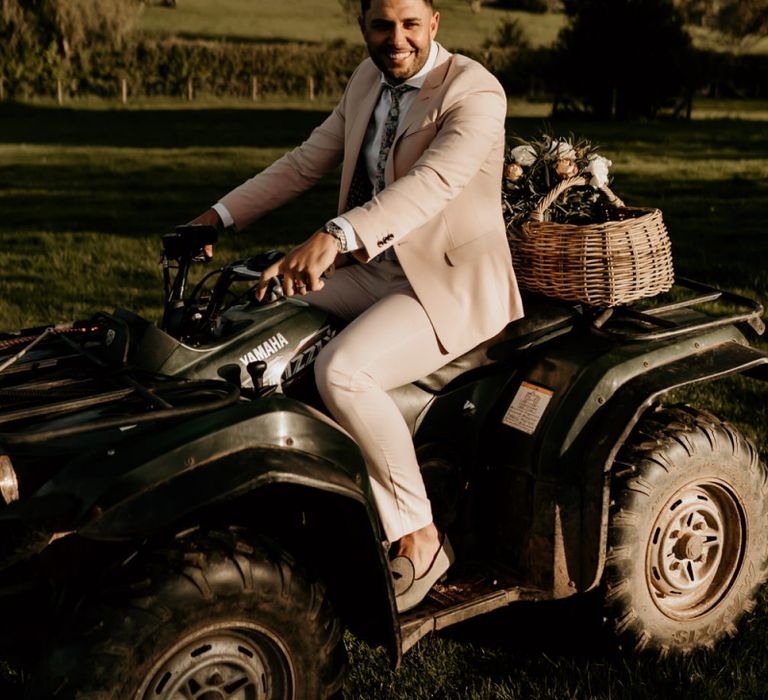 Groom in Pink Suit Riding a Quad Bike