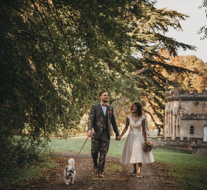 Black bride in tea length wedding dress with curly hair