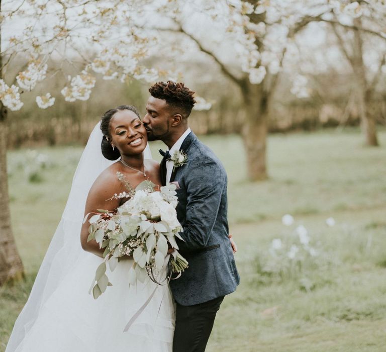 Black bride in off the shoulder wedding dress