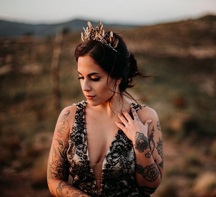 Bride in Black Lace Wedding Dress and Gold Crown Headpiece