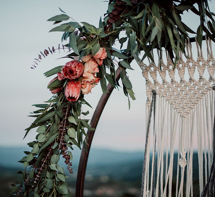 Steel Moon Gate Decorated with Macrame, Red Flowers and Foliage