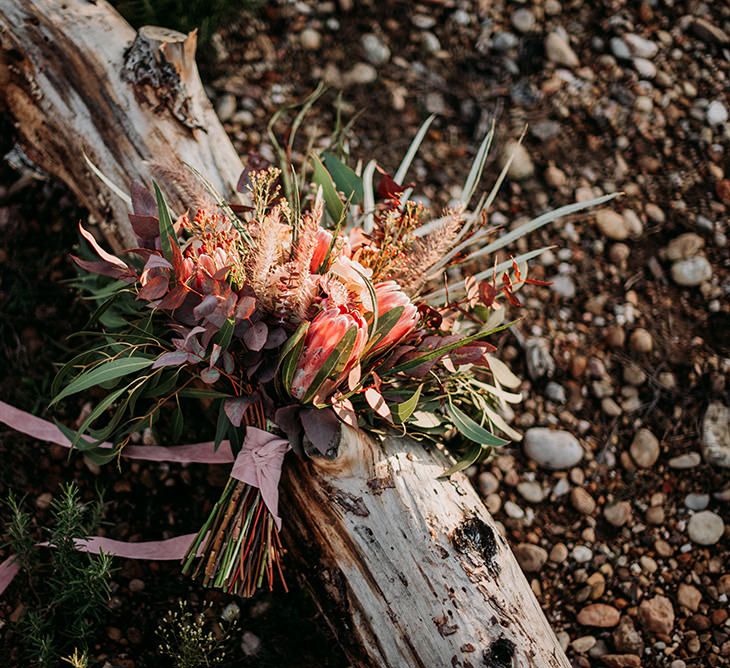 Deep Red and Green Wedding Bouquet with King Proteas and Ribbon