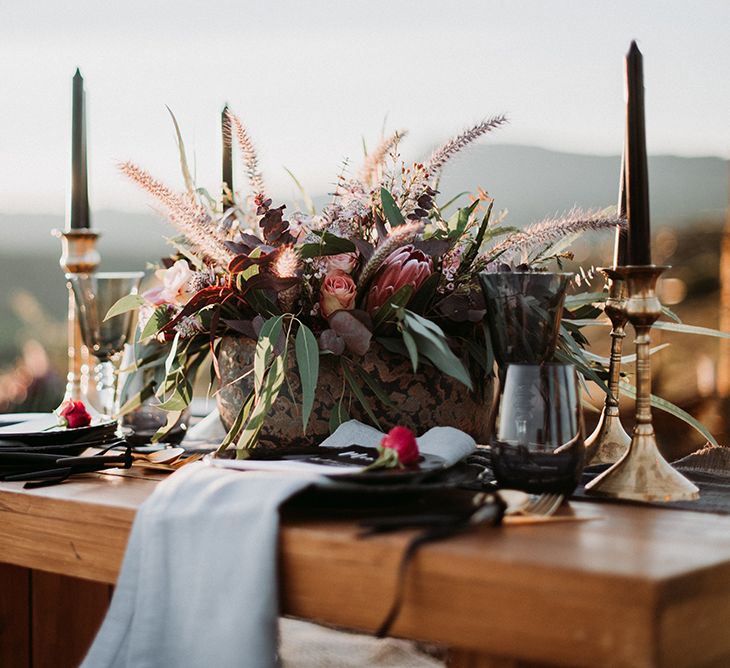 Sweetheart Table Decor with Gold Candle Sticks Black Taper Candles and Deep Red Floral Centrepiece