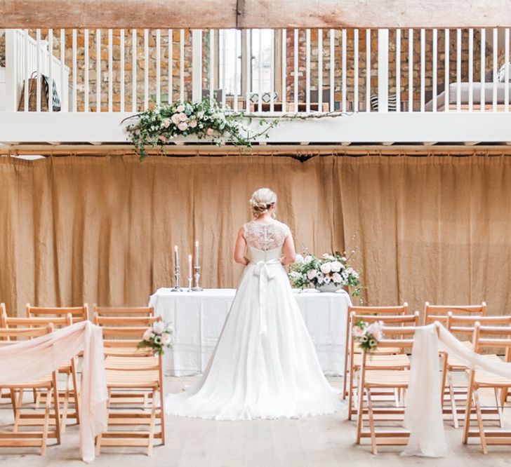 Bride at the Altar in Lace Bardot Gown | Blush Pink, Romantic, Country Wedding Inspiration at Tithe Barn, Dorset | Darima Frampton Photography