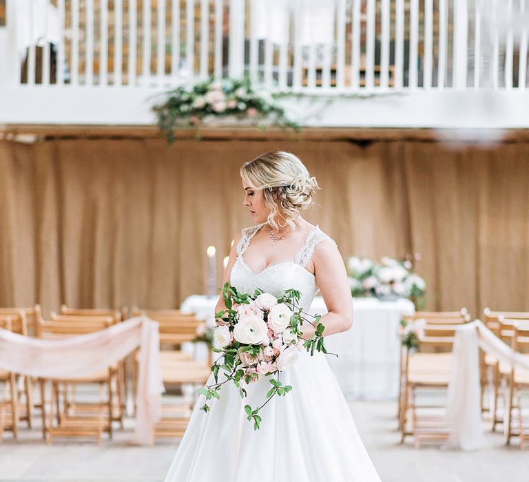 Bride at the Altar in Princess Wedding Dress |  Pink Ranunculus Bridal Bouquet | Blush Pink, Romantic, Country Wedding Inspiration at Tithe Barn, Dorset | Darima Frampton Photography