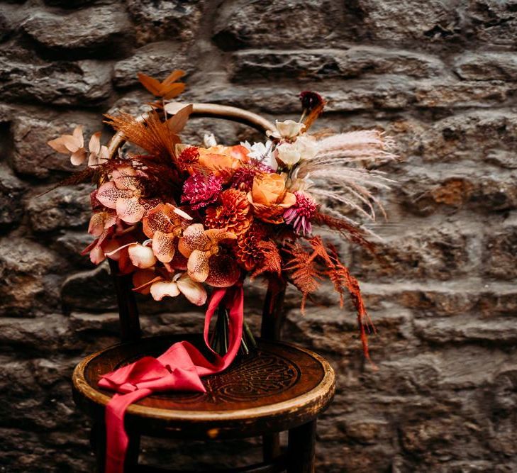 Caramel, raspberry and rust wedding theme bouquet