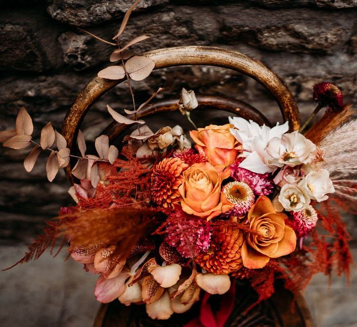 Caramel, raspberry and rust wedding bouquet