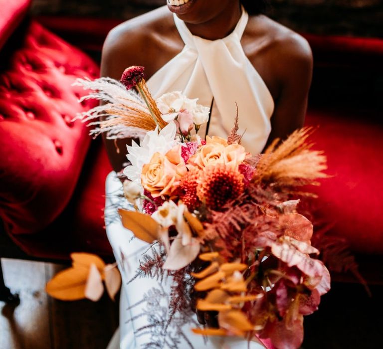 Caramel, Raspberry and rust wedding theme floral bouquet