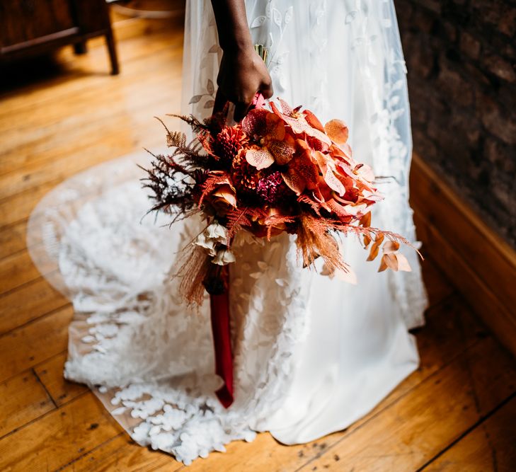 Caramel, rapsberry and rust wedding theme flowers