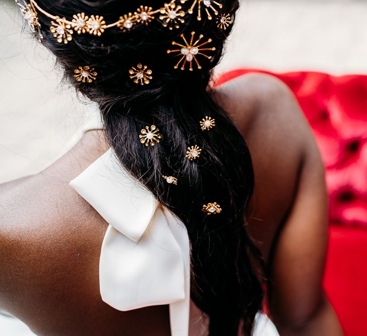 Wedding hairstyle with gold hair clips and accessories