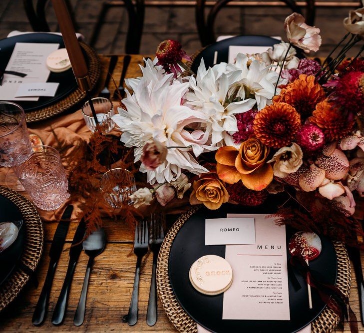 Floral centrepiece with caramel, raspberry and rust theme decor