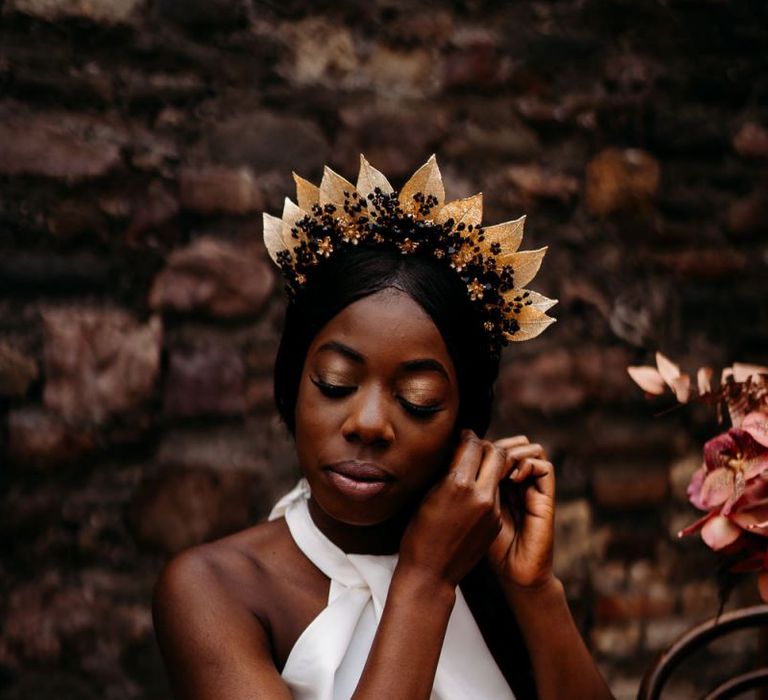 Beautiful bride in Hermione Harbutt bridal crown for rust wedding theme