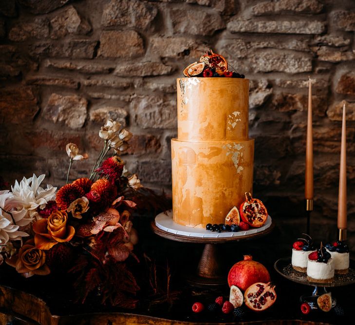 Dessert table with rust coloured wedding cake for rust wedding theme