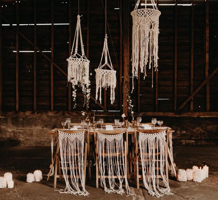 Macrame Chair Backs &amp; Hangings | Table Scape | Goblets with Flower Stems  &amp; Vintage Plate Wedding Decor | Boho at The Barns at Lodge Farm, Essex, by Rock The Day Styling | Kelsie Low Photography