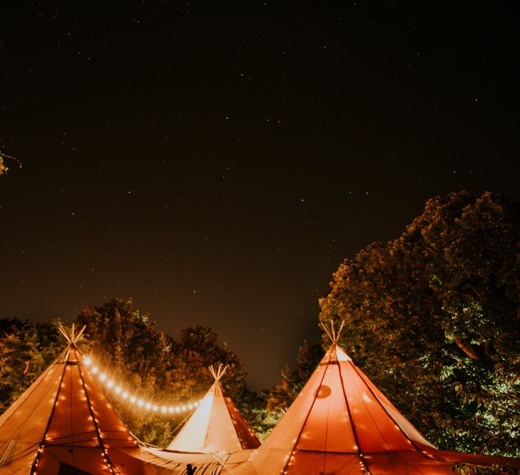 Tipi Wedding At Night // Image by Rosie Kelly Photography