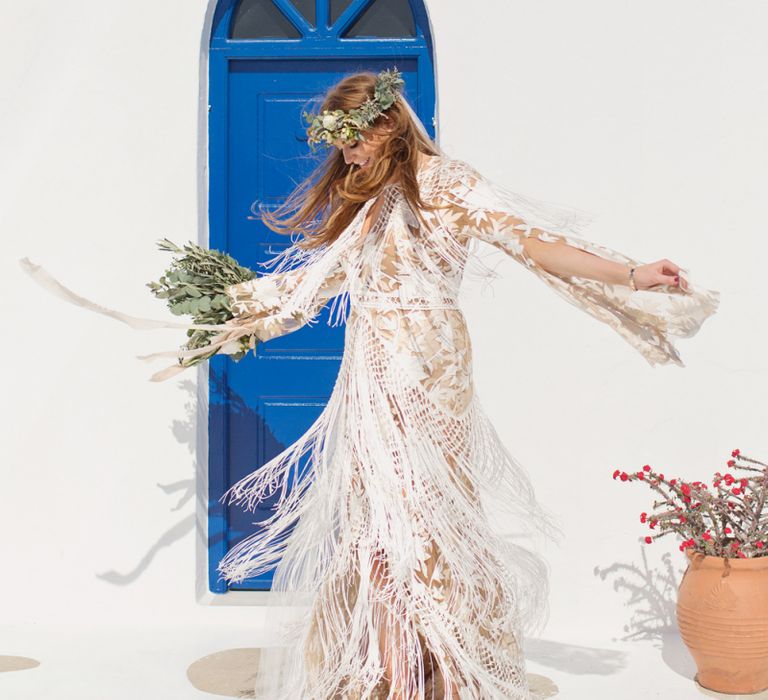 Bride in fringe boho wedding dress twirling