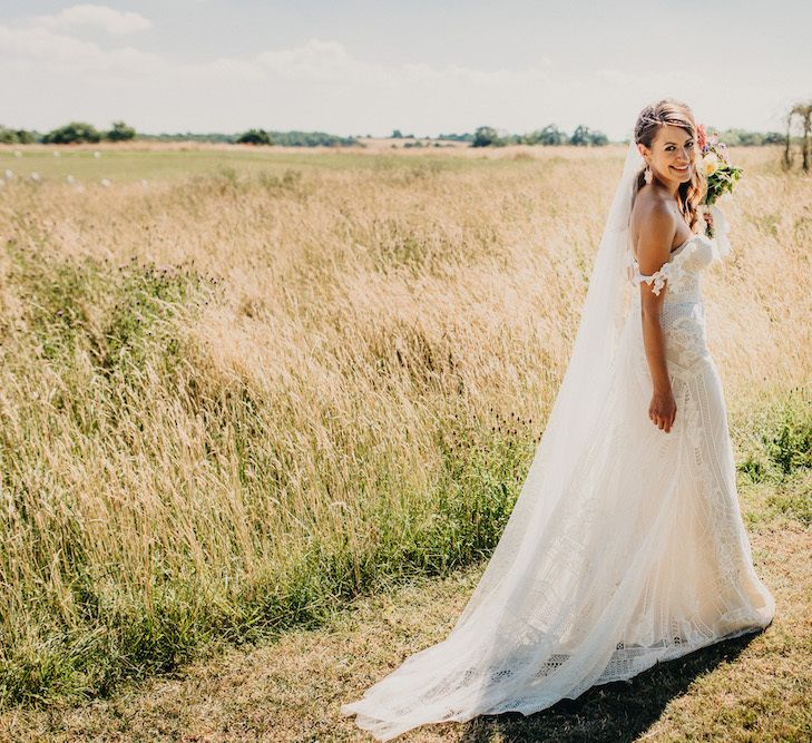 Lace wedding dress with Bardot sleeves